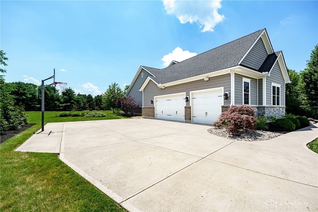 7949 Bending Willow Ct, Clearcreek Twp, OH 45068 - view of property exterior with a garage, a yard, driveway, a shingled roof, and stone siding