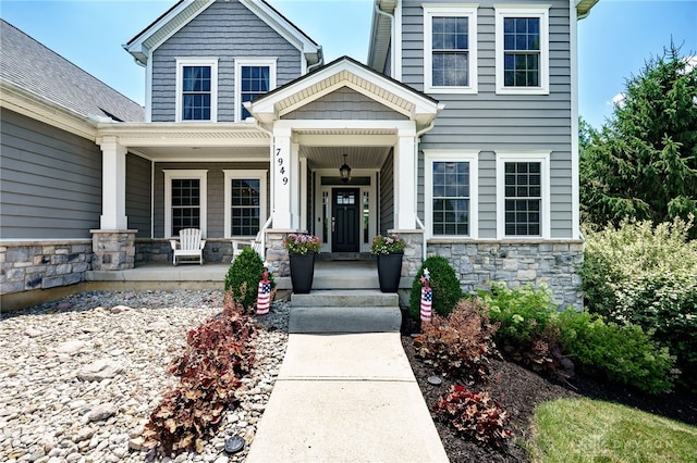 7949 Bending Willow Ct, Clearcreek Twp, OH 45068 - entrance to property featuring stone siding and covered porch