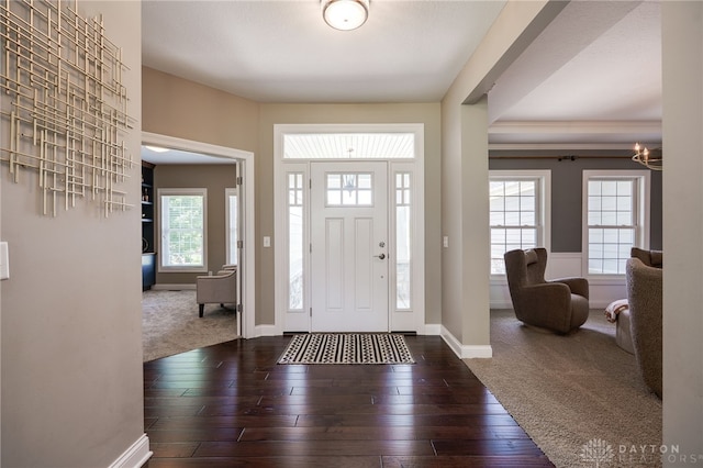 7949 Bending Willow Ct, Clearcreek Twp, OH 45068 - foyer entrance featuring carpet floors, hardwood / wood-style flooring, and a chandelier