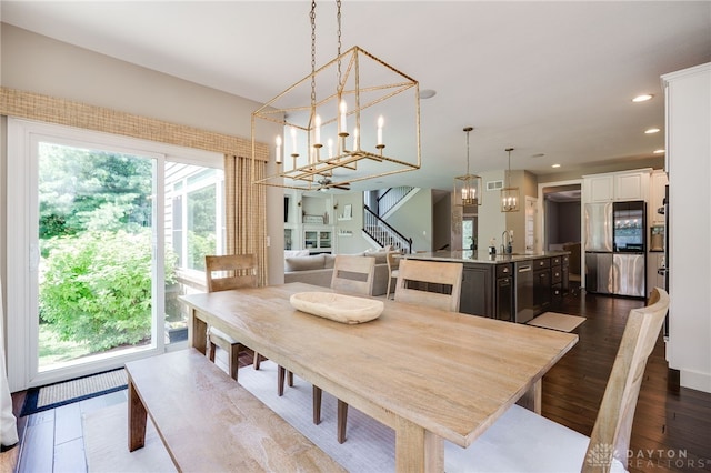 7949 Bending Willow Ct, Clearcreek Twp, OH 45068 - dining space with a chandelier, stairway, dark wood finished floors, and recessed lighting
