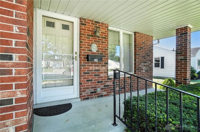 634 S Main, West Milton, OH 45383 - view of exterior entry with brick siding and covered porch