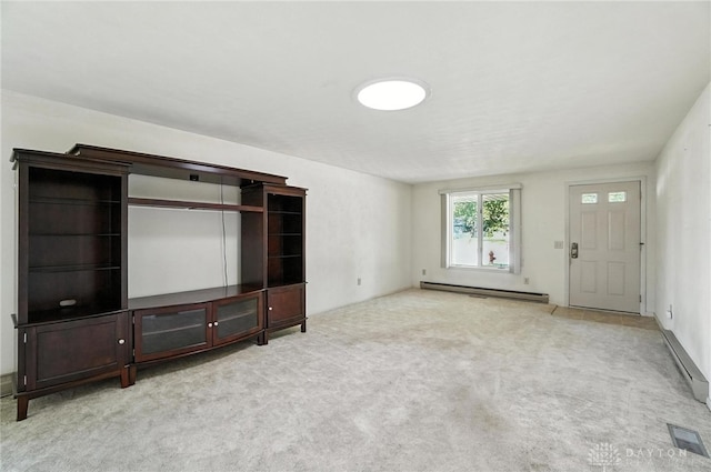 634 S Main, West Milton, OH 45383 - unfurnished living room with a baseboard radiator and carpet