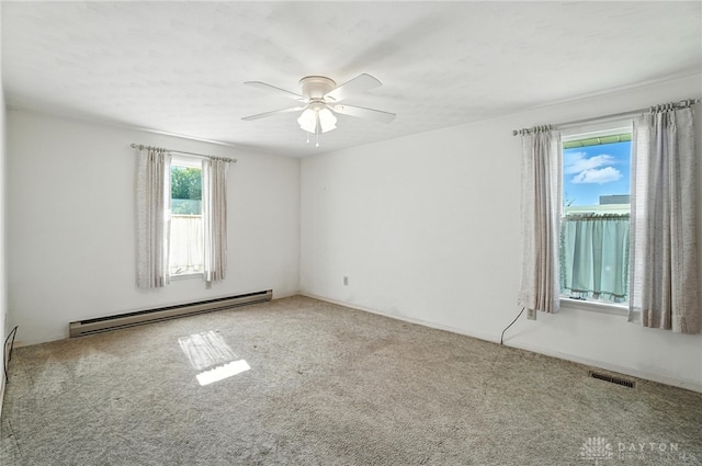 634 S Main, West Milton, OH 45383 - carpeted spare room featuring a baseboard heating unit and a ceiling fan