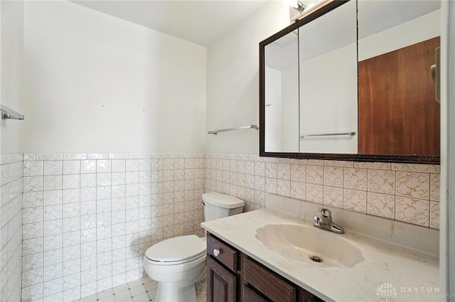 634 S Main, West Milton, OH 45383 - bathroom with tile walls, vanity, and wainscoting