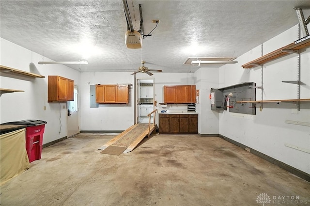 634 S Main, West Milton, OH 45383 - garage featuring a garage door opener, electric panel, and a ceiling fan