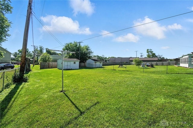 634 S Main, West Milton, OH 45383 - fenced backyard with a storage unit