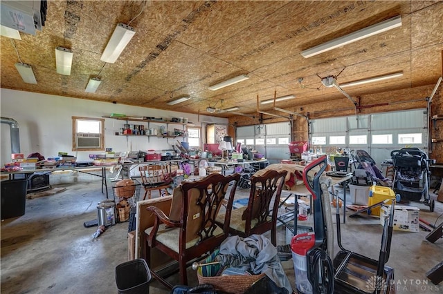513 S High St, Arcanum, OH 45304 - garage featuring a workshop area and cooling unit