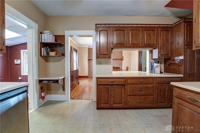 513 S High St, Arcanum, OH 45304 - kitchen with dishwasher, light countertops, and brown cabinets