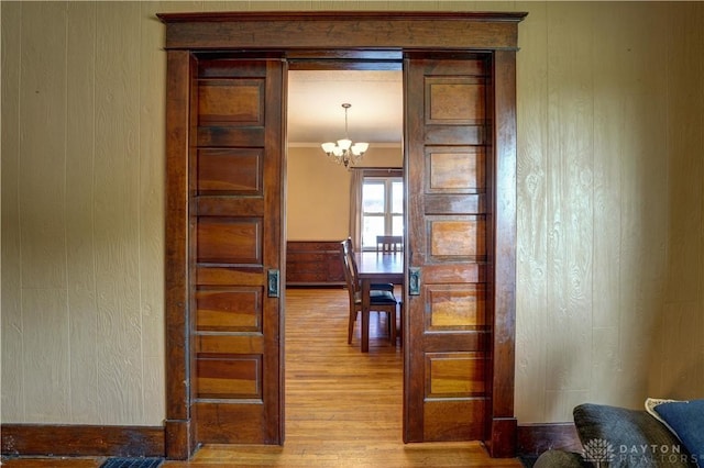 513 S High St, Arcanum, OH 45304 - dining area featuring light wood-style flooring and a chandelier