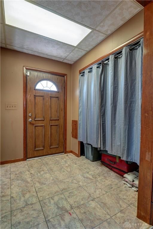 513 S High St, Arcanum, OH 45304 - entrance foyer featuring baseboards and a paneled ceiling