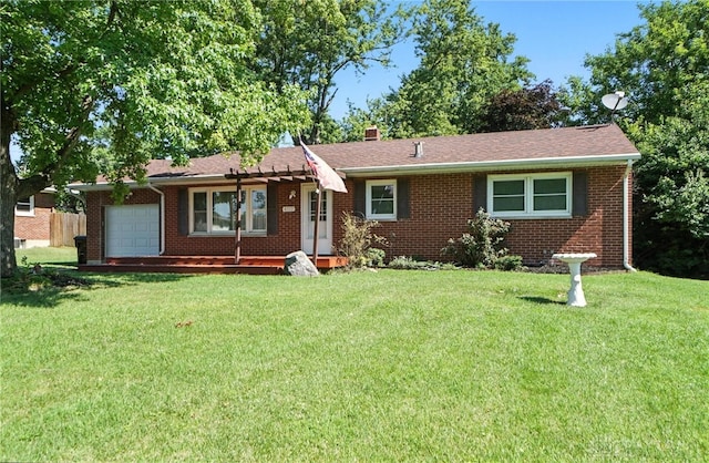 4513 Hannah Dr, Middletown, OH 45044 - ranch-style home with brick siding, a front yard, an attached garage, and a chimney