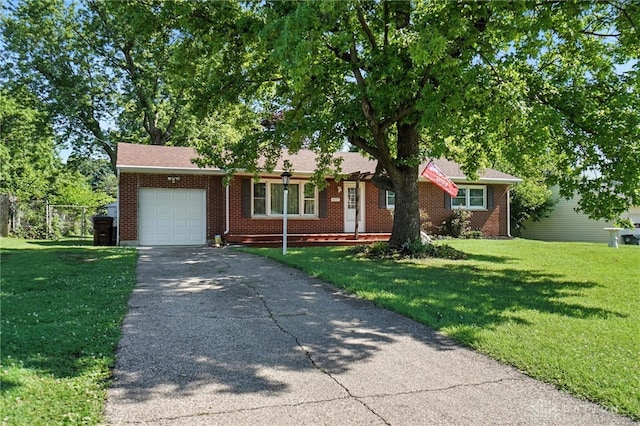 4513 Hannah Dr, Middletown, OH 45044 - view of front of property with a garage, asphalt driveway, and brick siding