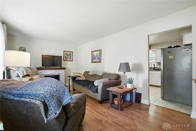 4513 Hannah Dr, Middletown, OH 45044 - living area with light wood finished floors and a stone fireplace