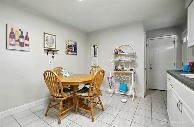 4513 Hannah Dr, Middletown, OH 45044 - dining room with light tile patterned floors and baseboards
