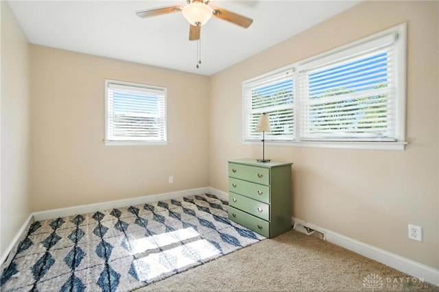 4513 Hannah Dr, Middletown, OH 45044 - unfurnished bedroom with carpet floors, multiple windows, and ceiling fan