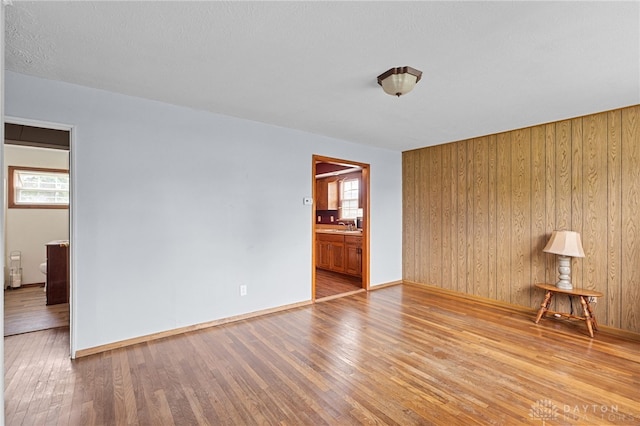 250 Pat Ln, Fairborn, OH 45324 - spare room with wood finished floors and wood walls