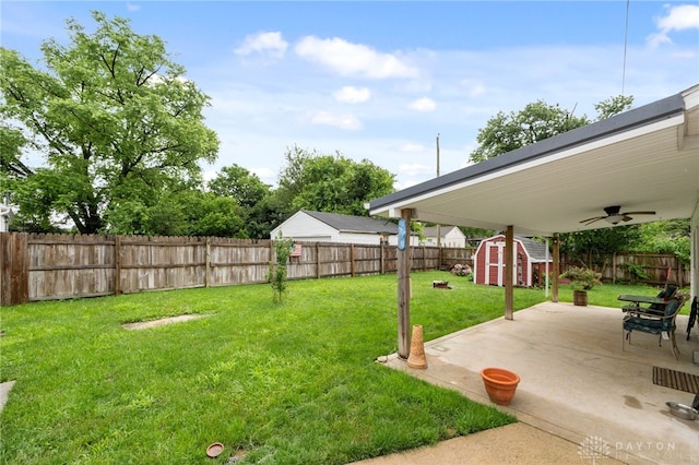 250 Pat Ln, Fairborn, OH 45324 - fenced backyard featuring a storage shed, a patio, and ceiling fan