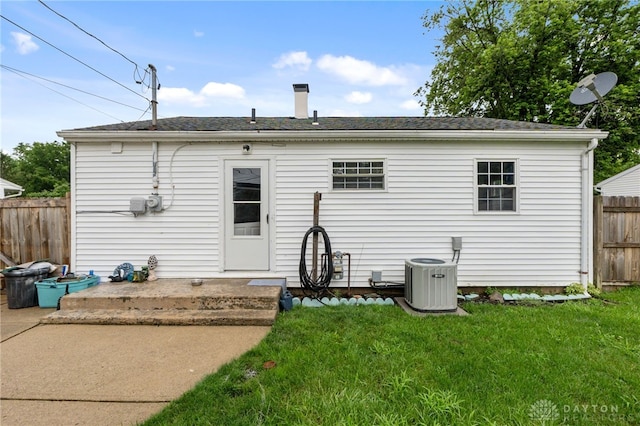 250 Pat Ln, Fairborn, OH 45324 - back of house with a chimney, roof with shingles, and a patio