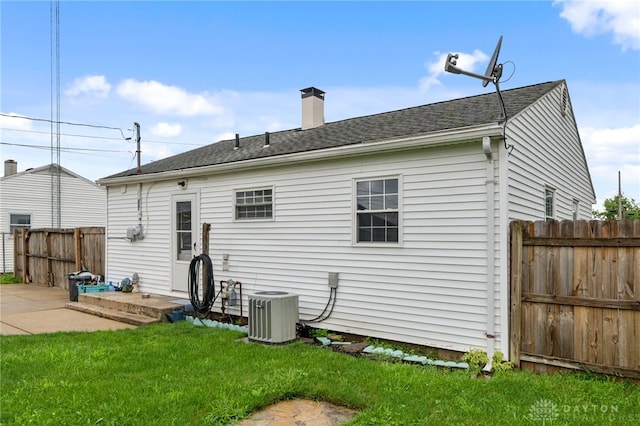 250 Pat Ln, Fairborn, OH 45324 - rear view of house featuring a chimney and a shingled roof