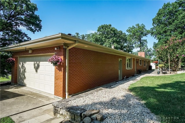 5975 Oakridge Dr, Hamilton, OH 45011 - view of side of home featuring brick siding and a chimney