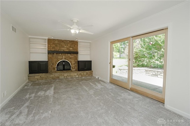 5975 Oakridge Dr, Hamilton, OH 45011 - unfurnished living room featuring carpet, a fireplace, built in features, ceiling fan, and crown molding