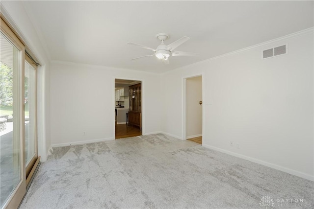5975 Oakridge Dr, Hamilton, OH 45011 - empty room with ceiling fan, ornamental molding, and carpet flooring