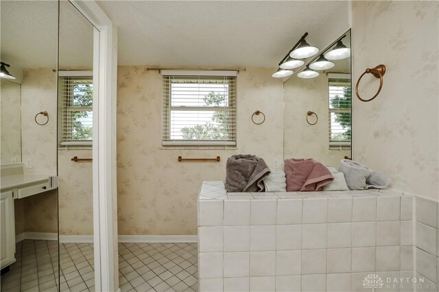 5975 Oakridge Dr, Hamilton, OH 45011 - bathroom featuring tile patterned floors, vanity, and wallpapered walls