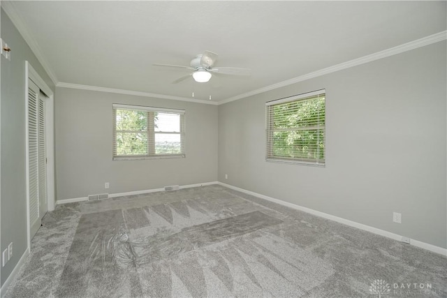 5975 Oakridge Dr, Hamilton, OH 45011 - unfurnished bedroom featuring crown molding, carpet floors, a closet, and ceiling fan