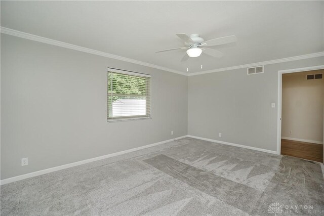 5975 Oakridge Dr, Hamilton, OH 45011 - empty room with ornamental molding, a ceiling fan, and carpet flooring