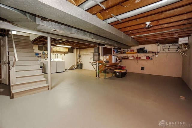 5975 Oakridge Dr, Hamilton, OH 45011 - unfinished below grade area featuring washer and dryer and stairway