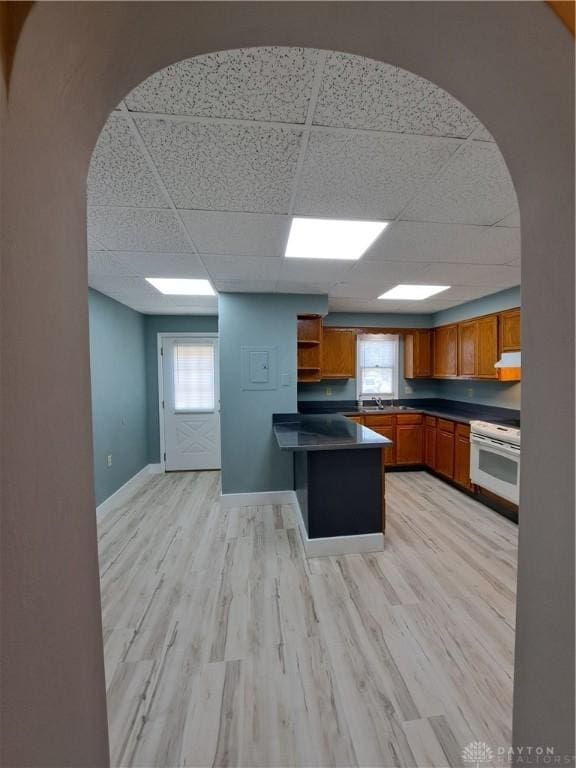 230 S 5th St, Miamisburg, OH 45342 - kitchen with dark countertops, a paneled ceiling, white electric range oven, brown cabinets, and open shelves