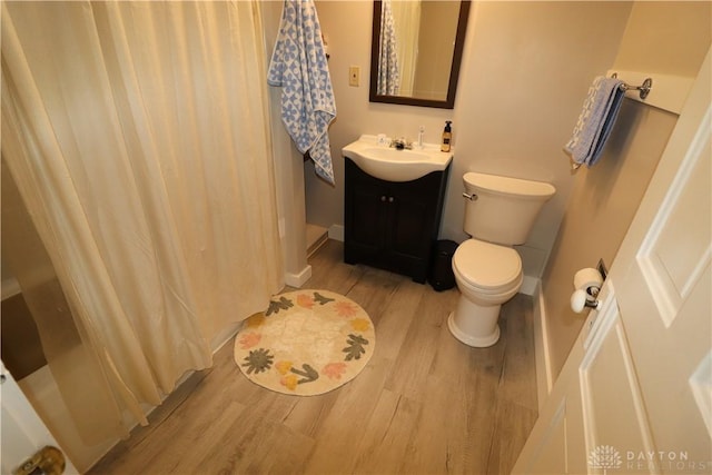 230 S 5th St, Miamisburg, OH 45342 - bathroom with wood finished floors, vanity, and shower / bath combination with curtain