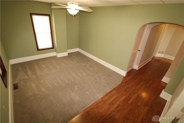 230 S 5th St, Miamisburg, OH 45342 - spare room featuring a ceiling fan, dark wood-style flooring, and arched walkways