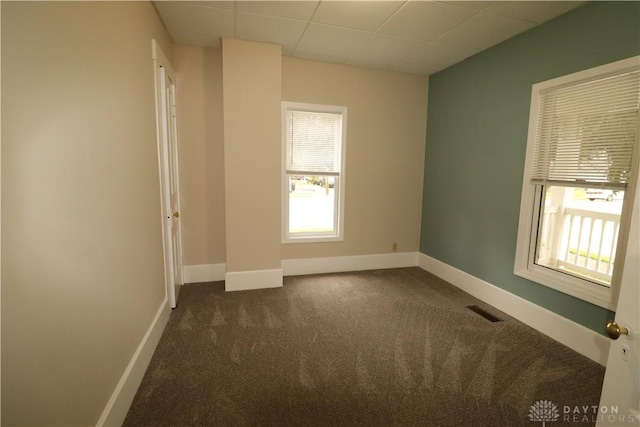 230 S 5th St, Miamisburg, OH 45342 - unfurnished room with dark colored carpet, plenty of natural light, and a paneled ceiling