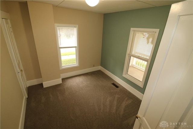 230 S 5th St, Miamisburg, OH 45342 - empty room featuring a drop ceiling and dark colored carpet
