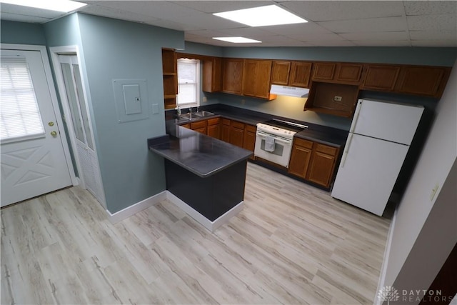 230 S 5th St, Miamisburg, OH 45342 - kitchen with freestanding refrigerator, wall oven, brown cabinetry, dark countertops, and a paneled ceiling