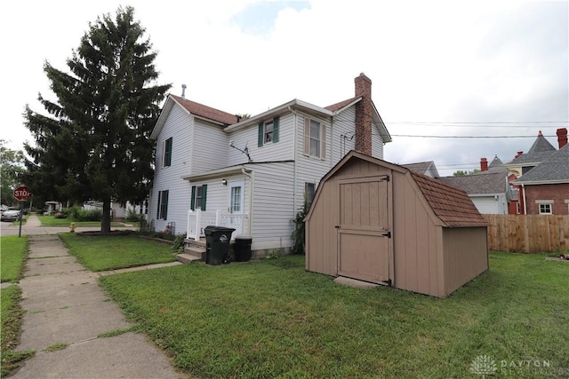 230 S 5th St, Miamisburg, OH 45342 - rear view of house featuring a storage unit and a chimney