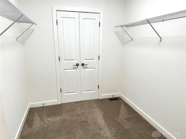 559 E Fosters Maineville Rd, Maineville, OH 45039 - walk in closet featuring dark colored carpet