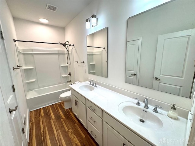 559 E Fosters Maineville Rd, Maineville, OH 45039 - bathroom with wood finished floors, double vanity, and tub / shower combination