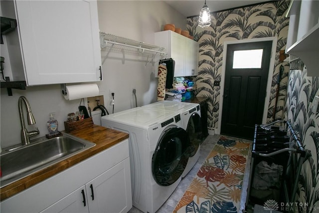 6377 Holloway Dr, Liberty Twp, OH 45044 - laundry area featuring cabinet space and washing machine and dryer