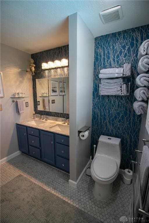 6377 Holloway Dr, Liberty Twp, OH 45044 - bathroom with double vanity and wallpapered walls