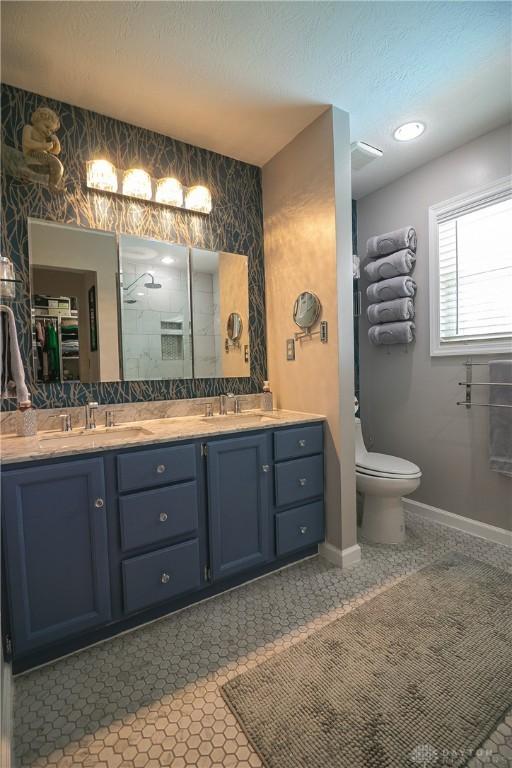 6377 Holloway Dr, Liberty Twp, OH 45044 - full bathroom featuring double vanity and a shower