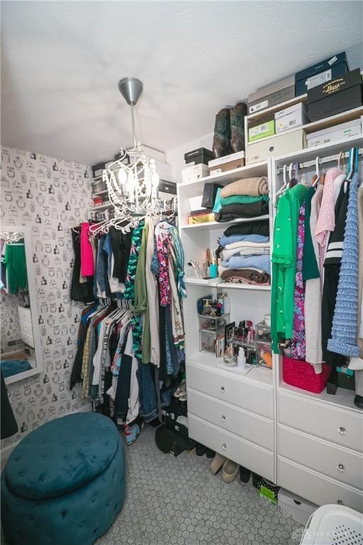 6377 Holloway Dr, Liberty Twp, OH 45044 - walk in closet featuring a chandelier