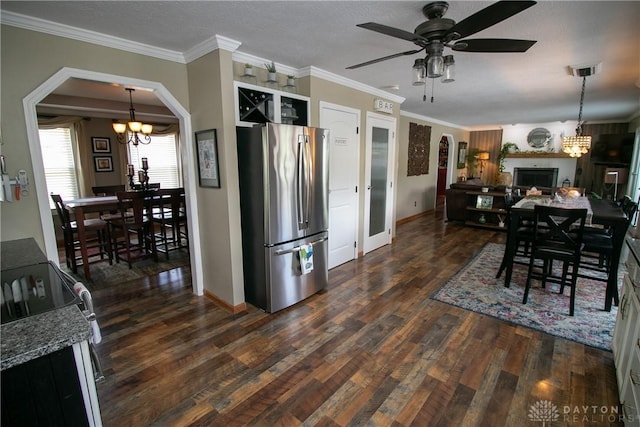 6377 Holloway Dr, Liberty Twp, OH 45044 - kitchen featuring freestanding refrigerator, a chandelier, dark wood finished floors, a ceiling fan, and arched walkways