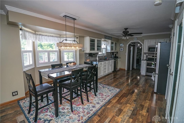 6377 Holloway Dr, Liberty Twp, OH 45044 - dining area with a ceiling fan, ornamental molding, and dark wood-style flooring