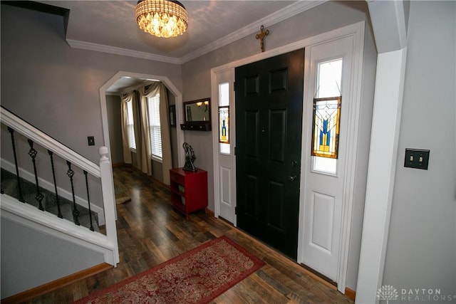 6377 Holloway Dr, Liberty Twp, OH 45044 - foyer with a chandelier, wood finished floors, stairway, ornamental molding, and arched walkways