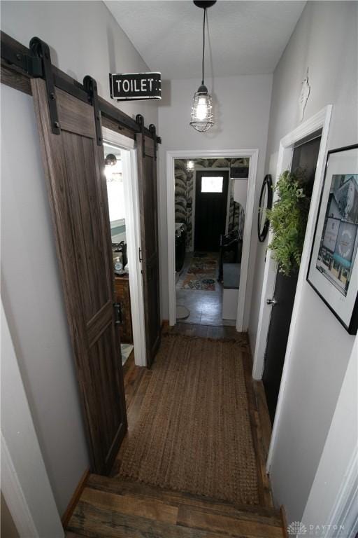 6377 Holloway Dr, Liberty Twp, OH 45044 - hallway with a barn door, plenty of natural light, and wood finished floors