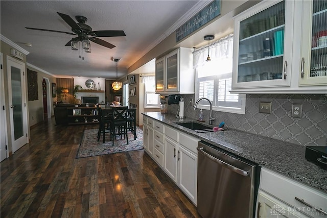 6377 Holloway Dr, Liberty Twp, OH 45044 - kitchen featuring stainless steel dishwasher, tasteful backsplash, dark stone counters, dark wood-style floors, and ornamental molding