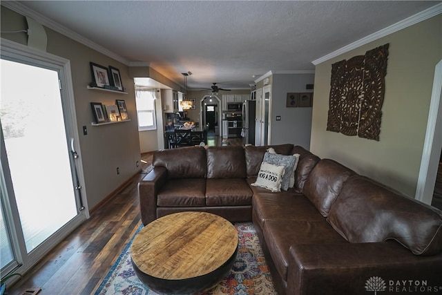 6377 Holloway Dr, Liberty Twp, OH 45044 - living area featuring dark wood-style floors, crown molding, and a ceiling fan