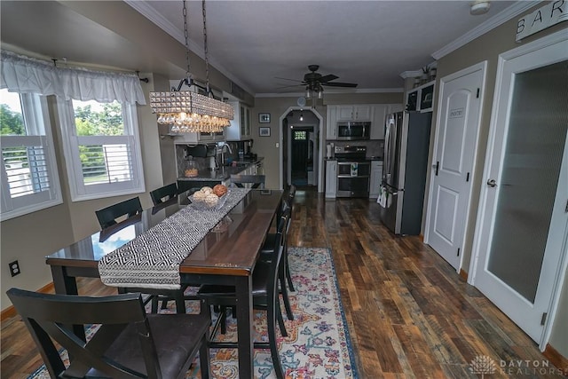 6377 Holloway Dr, Liberty Twp, OH 45044 - dining area with ornamental molding, ceiling fan, arched walkways, and dark wood-style floors